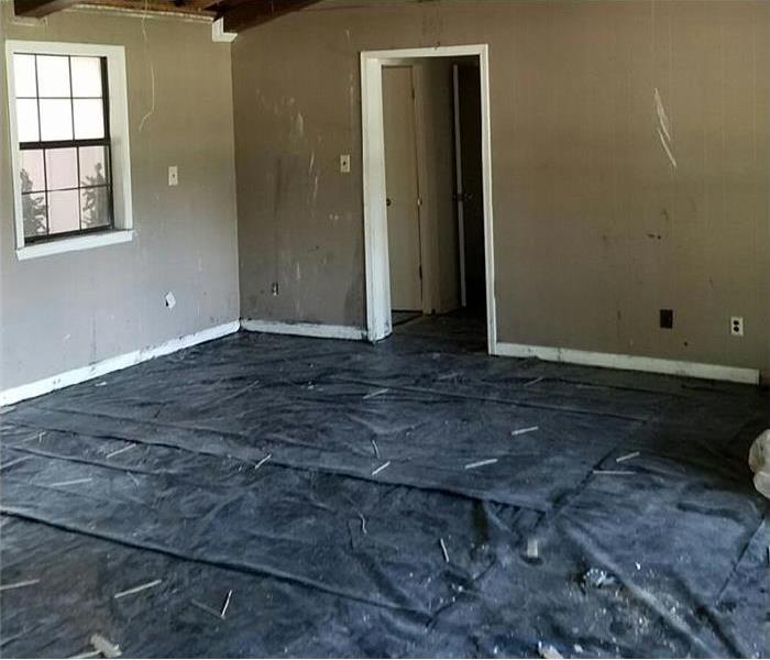interior of home with damaged floors removed ready for new floor install after fire and water damage