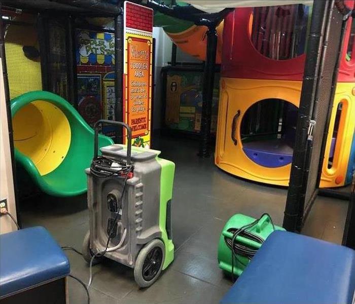 indoor playscape with drying equipment after water damage