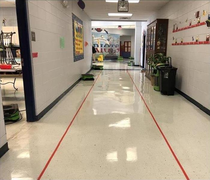 green drying equipment in elementary school hallway