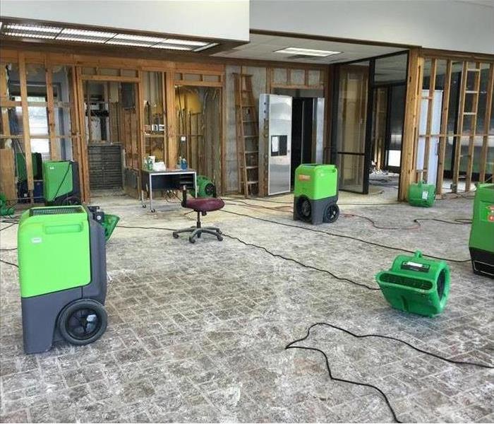green drying equipment in the lobby of a bank after a flood